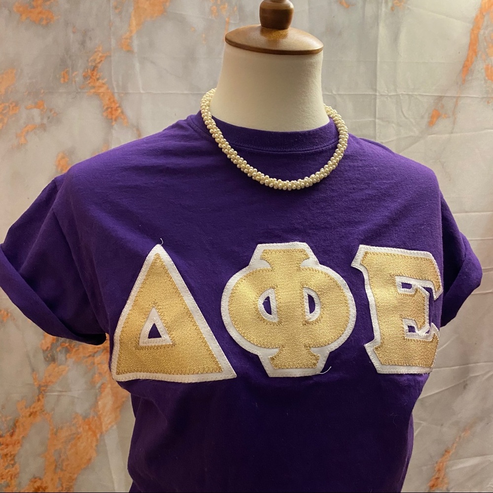 DPHIE purple& gold greek letters T-shirt sz. small